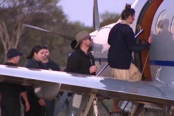 Carolina Wilga boards a plane to be flown to Perth after her rescue.