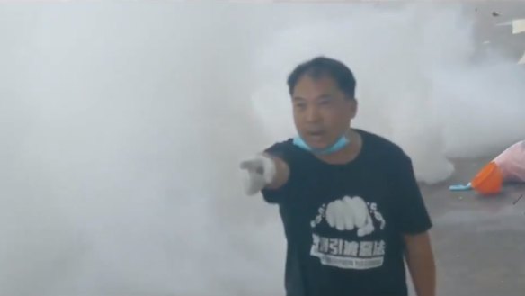 Hong Kong legislator Wu Chi-wai walked alone towards heavily armed police who were firing tear gas at protesters. He yelled: "I want to see your commander!"