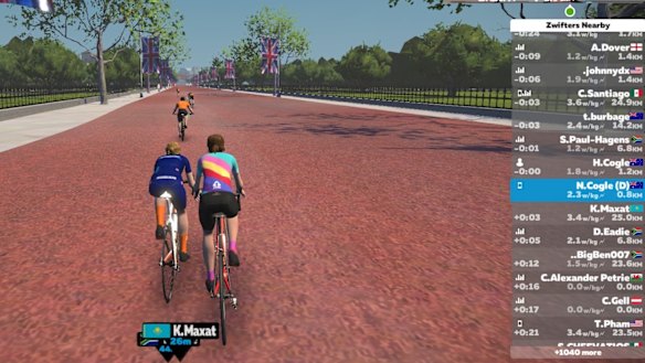 The Cogles' avatars on a Zwift screen during an indoor training ride. 