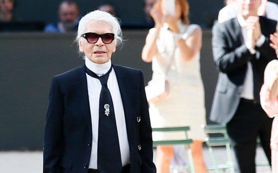 Karl Lagerfeld acknowledges applause after the presentation of Chanel's Haute Couture Fall/Winter 2017/2018 fashion collection in Paris.