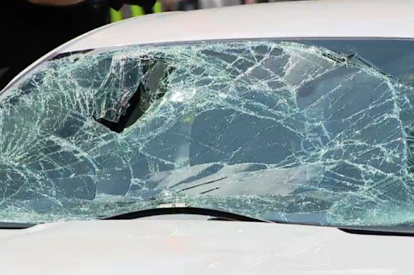 The white sedan driven by Thomas Cahill was badly damaged in the collision.