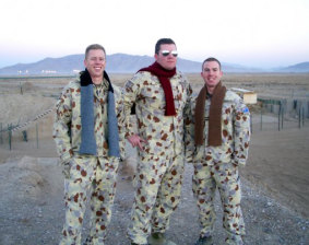The late RAAF Flight Lieutenant Josh Chalmers (centre) in Afghanistan with friends. 