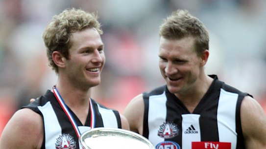 Ben Johnson with then teammate Nathan Buckley after an Anzac Day win in 2006.