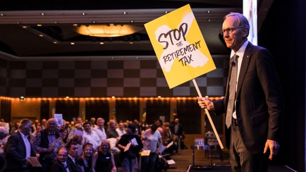 Wilson Asset Management Chairman Geoff Wilson and shareholders protest against Labor's proposed changes to the tax rules of dividend imputation at the Wilson Asset Management investor conference last year. 
