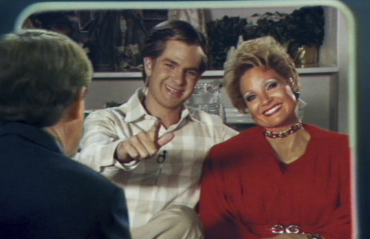  Andrew Garfield as Jim Bakker and Jessica Chastain as Tammy Faye Bakker in The Eyes Of Tammy Faye.