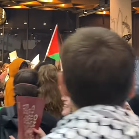 Protesters storm the ground floor of Broadway Shopping Centre.