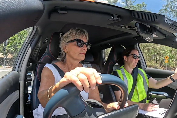 A participant driver testing vehicle safety systems alongside an instructor at Brisbane’s RACQ Mobility Centre. 
