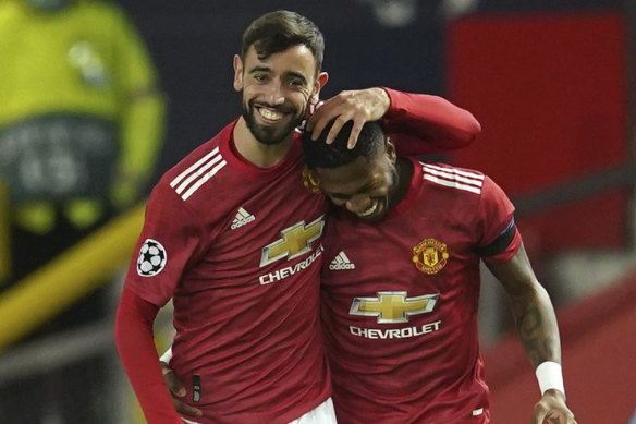 Bruno Fernandes and Fred celebrate the first of the former's two early goals in Manchester United's big win over Istanbul Basaksehir.