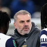 Ange Postecoglou celebrates with his players.