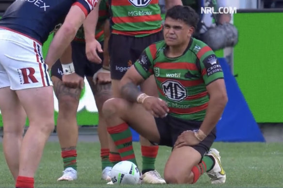 Latrell Mitchell stays down after being collected high by Sio Siua Taukeiaho
