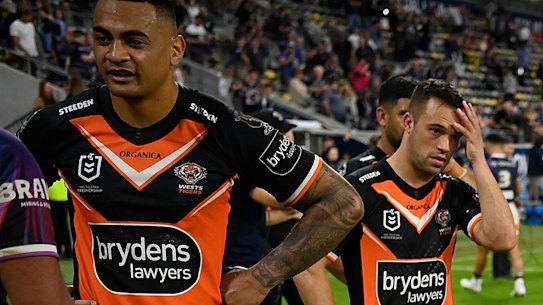 Tigers players try to digest the outcome after fulltime on Sunday.