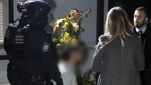 Arrest footage of one of the men charged over the alleged aggravated sexual assault.