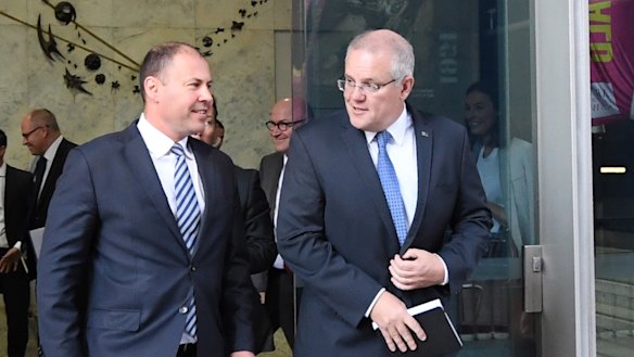 Treasurer Josh Frydenberg and Prime Minister Scott Morrison as they left the Reserve Bank following their meeting with governor Philip Lowe on Wednesday. 