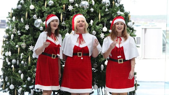 Christmas carollers have been directed to wear masks and sing in 'subdued' voices this year.