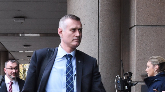 AFP officers arrive at the ABC, where they spent the afternoon sifting through thousands of documents, on Wednesday.
