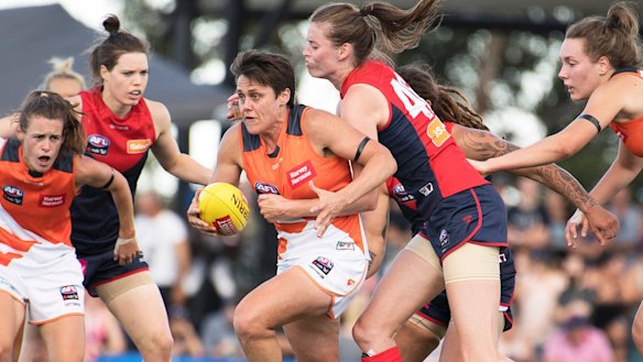 Courtney Gum plays midfield for the Giants and is mum to four-year-old Buz.