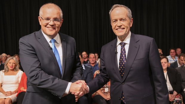 Prime Minister Scott Morrison and Opposition Leader Bill Shorten shake hands ahead of the debate. 