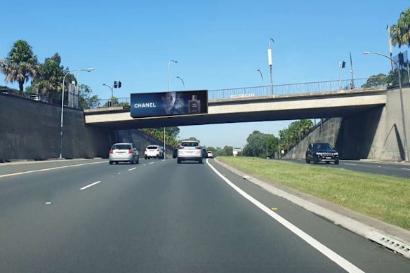 This billboard on the Burns Bay Road overpass at Hunters Hill prompted a backlash from residents.