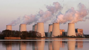 Exhaust plumes from cooling towers at the Jaenschwalde brown coal-fired power station in eastern Germany.