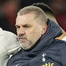 Tottenham’s head coach Ange Postecoglou leaves the field with Tottenham’s Rodrigo Bentancur at the end of the English Premier League soccer match between Manchester United and Tottenham Hotspur at the Old Trafford stadium in Manchester, England, Sunday, Jan.14,