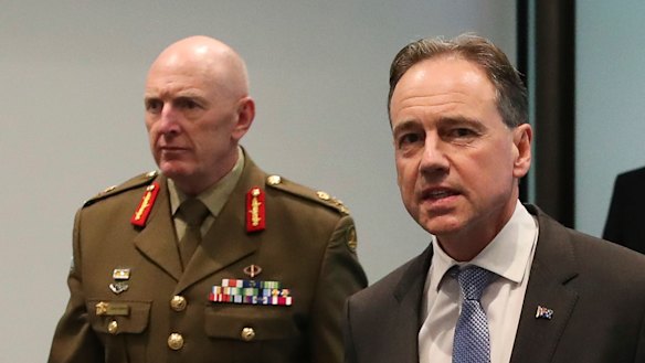 COVID-19 vaccine rollout chief Lieutenant-General John Frewen with federal Health Minister Greg Hunt.