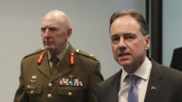 COVID-19 vaccine rollout chief Lieutenant-General John Frewen with federal Health Minister Greg Hunt.