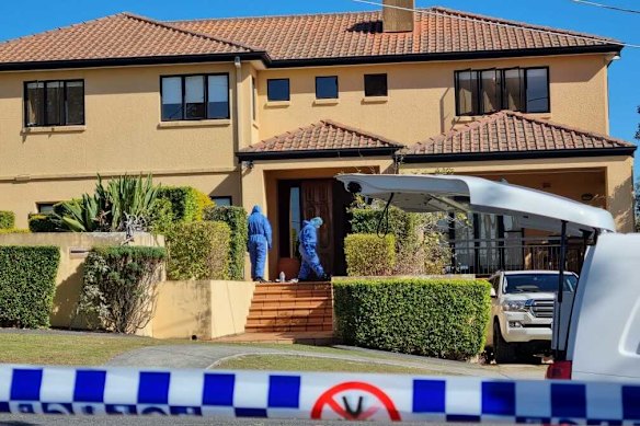 Detectives and forensic officers at the Kefu family’s Brisbane home.