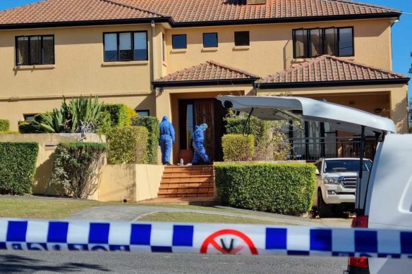 Detectives and forensic officers at the Kefu family’s Brisbane home after the home invasion.