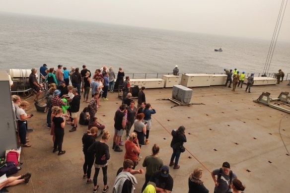 Evacuees on board the HMAS Choules.