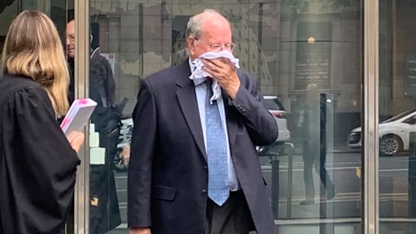 Paedophile brother Rex Francis Elmer tried to hide his face at the County Court in Melbourne on Monday.