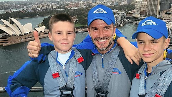 David Beckham with sons Cruz (L) and Romeo climbing the Sydney Harbour Bridge on Wednesday.