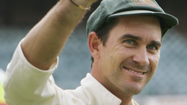 Justin Langer celebrates victory in his 100th Test.