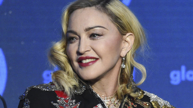 Madonna has been accused of false advertising by two people who attended her December concert in New York.