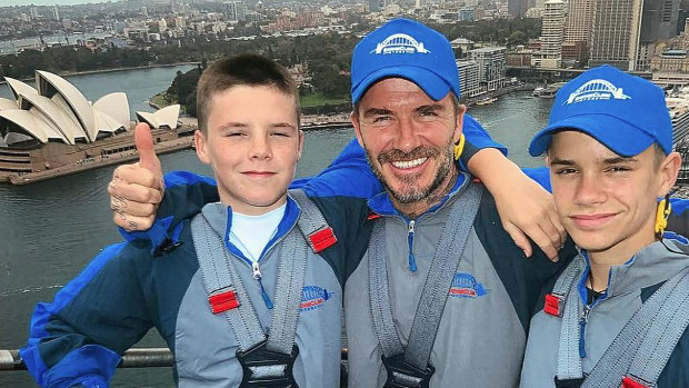 David Beckham with sons Cruz (L) and Romeo climbing the Sydney Harbour Bridge on Wednesday.