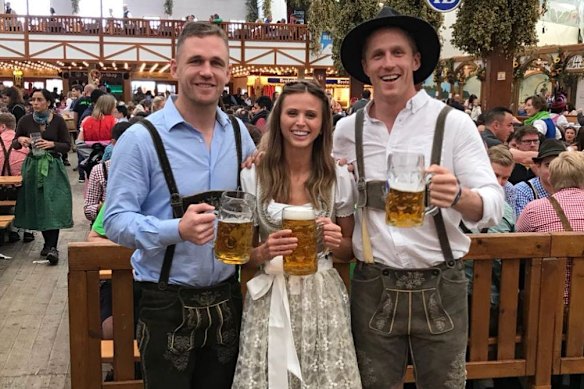 Joel Selwood (left), with now wife Britt and brother Scott, who is unconnected to this story, in Munich in 2018.