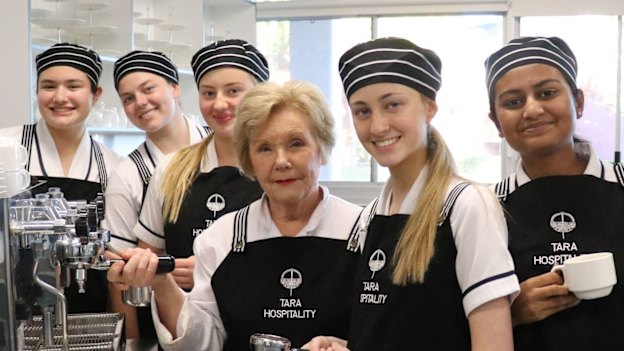 Teacher Judy Cropper with some of her HSC students. She says for exam success use the NESA syllabus, apply your knowledge and manage your time effectively.