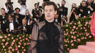 Harry Styles, laced up, at the Met Gala in May.