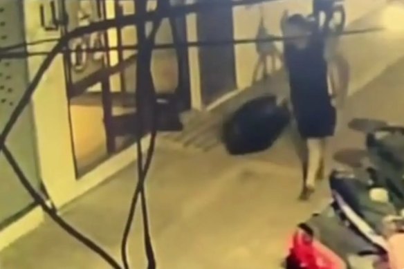 Vision allegedly showed Carman leaving his hotel with a black suitcase, before strapping it to a scooter and riding to a railway line about 10 minutes away.
