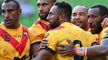 Papua New Guinea Kumuls players celebrate a try against England at the 2017 Rugby League World Cup quarter finals.