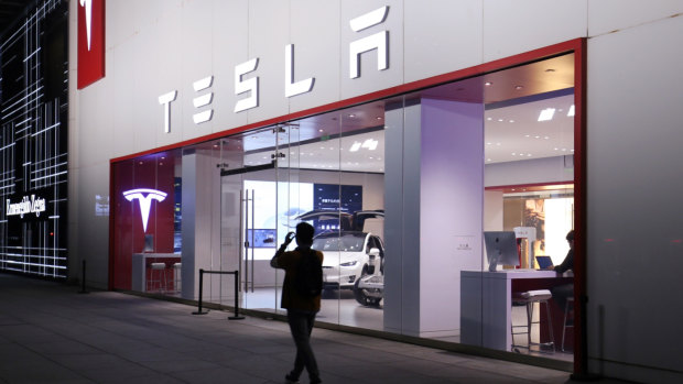 Chinese consumers may opt for European and Japanese cars instead of popular American brands like Tesla, its Beijing shop above, which will become more expensive with the new tariffs.