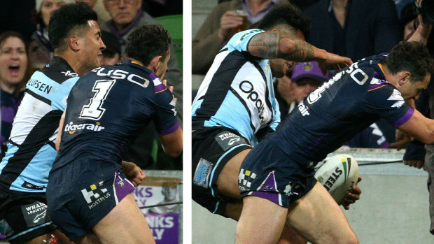 Collision: Billy Slater shoulder-charges Sosaia Feki in the preliminary final.