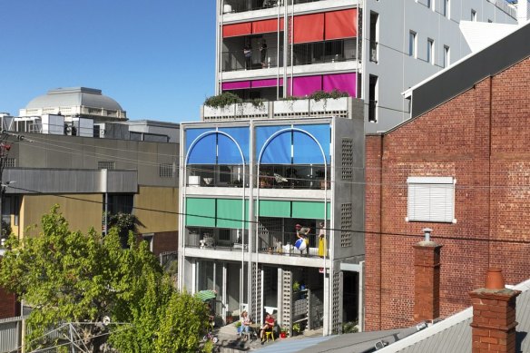 The Terrace House features bright, colourful canvas awnings.