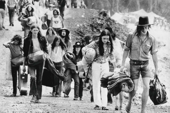 Sunbury Pop Festival.  Fans leave with their belongings at the end of the festival, February 1972