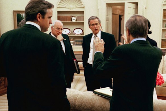 Centre of attention: Cheney (centre, left) played a much larger White House role than many previous deputies.