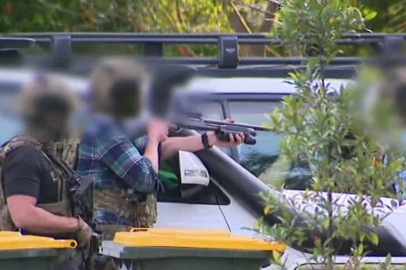 Officers at the scene in Nundah on Sunday afternoon. 