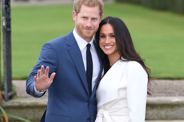 Prince Harry and Meghan Markle pose for their royal engagement photo call in the Sunken Garden at Kensington Palace in November 2017