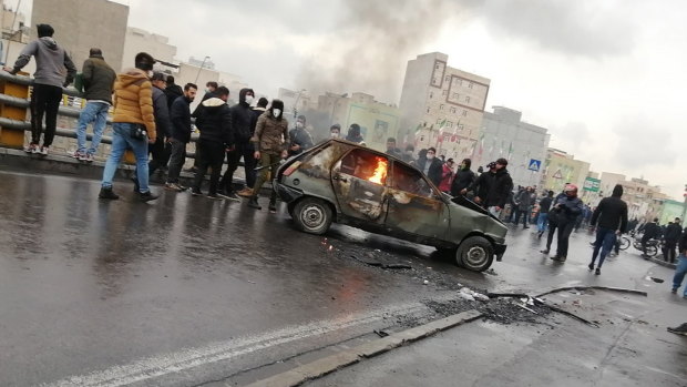 Iran's supreme leader backed the government's decision to raise gasoline prices and called angry protesters who have been setting fire to public property over the hike "thugs." 