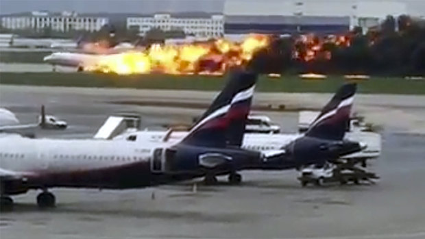 This image taken from video provided by Instagram user @artempetrovich, shows the SSJ-100 aircraft of Aeroflot Airlines on fire during an emergency landing in Sheremetyevo airport in Moscow, Russia.