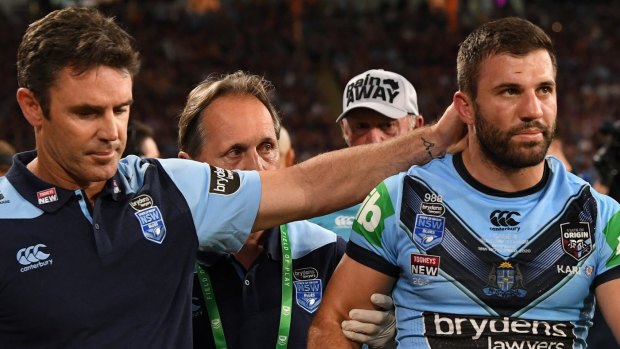Brad Fittler consoles James Tedesco after a head knock forced him from the field.
