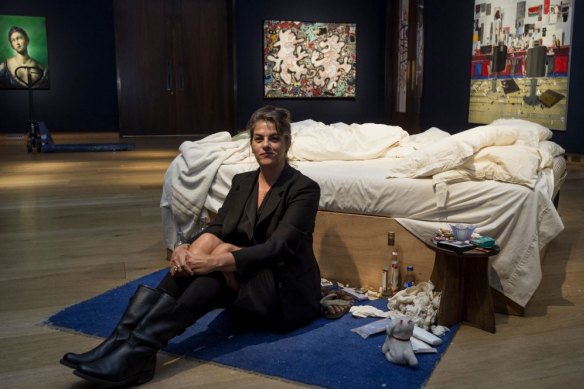 Tracey Emin sits near her iconic art installation, My Bed, which was short-listed for the 1999 Turner Prize. 